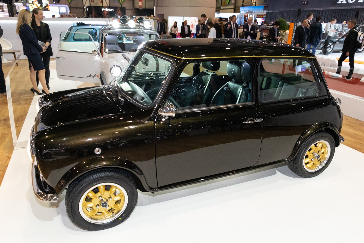 Glossy black classic compact with distinctive gold alloy wheels