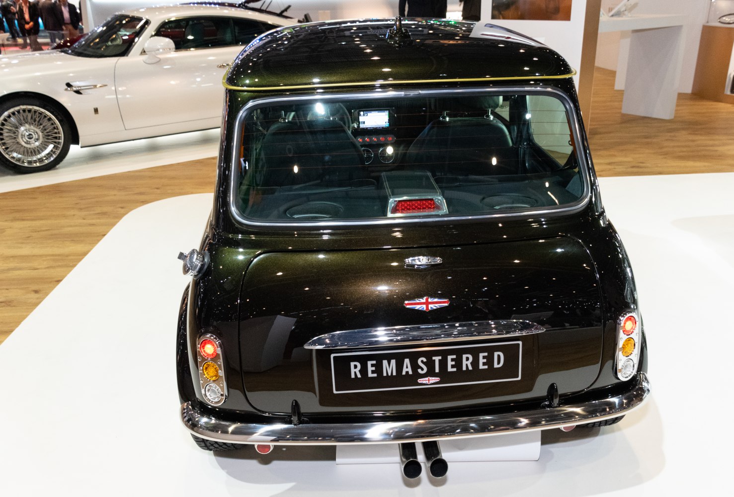 Rear hatchback with vertical tail lights and dual exhaust pipes