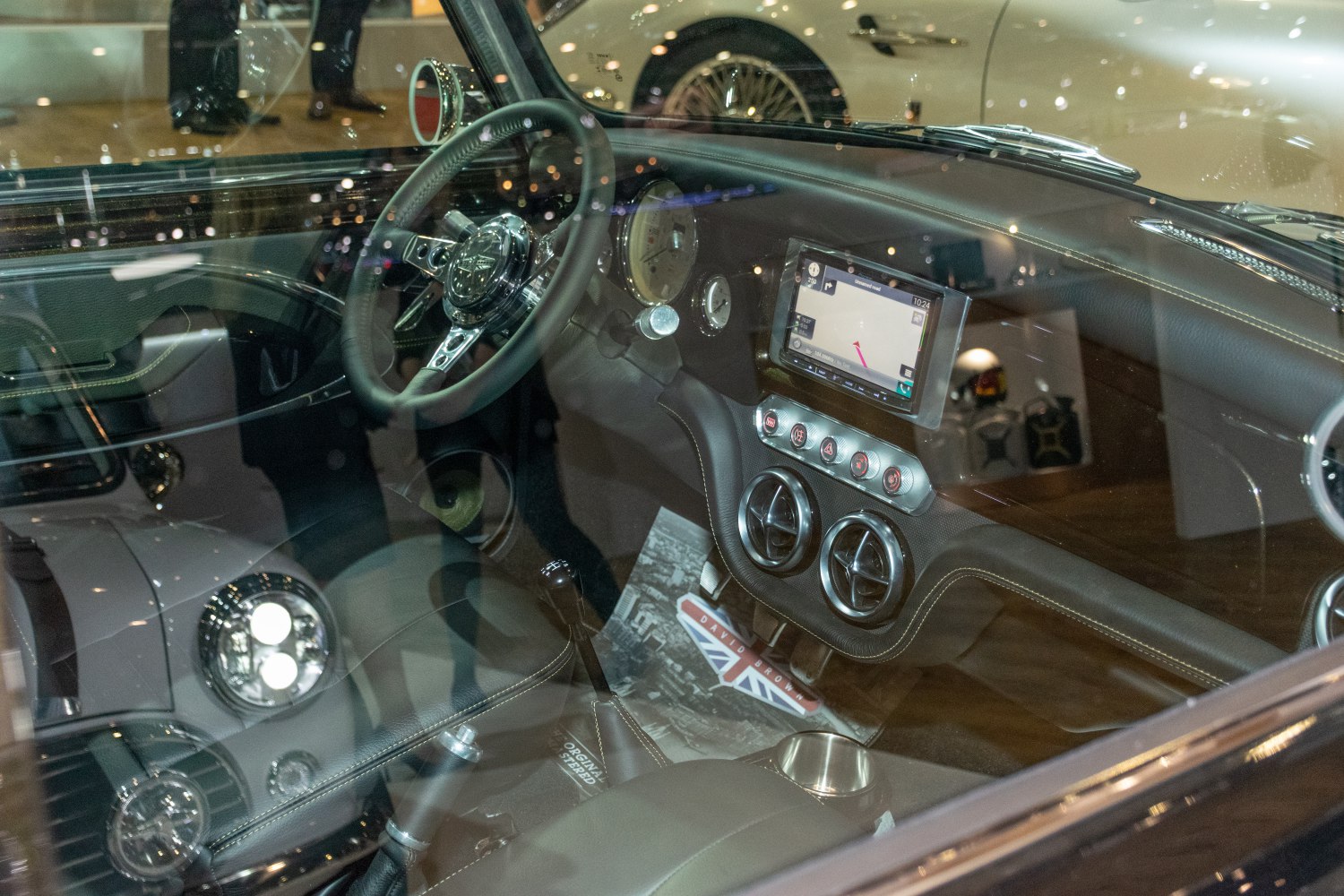 Classic dashboard with analog gauges and modern touchscreen display