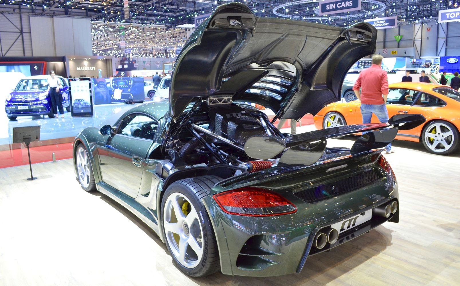 Rear view with open engine cover and large rear spoiler