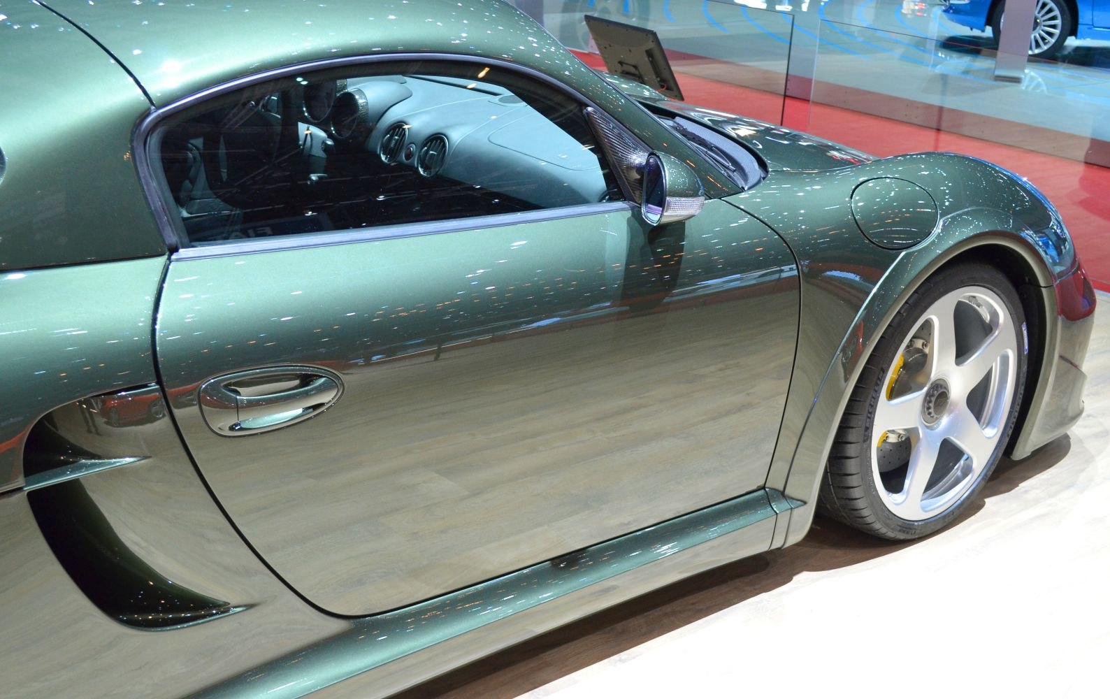 Sleek side profile with aerodynamic curves and five-spoke wheel design