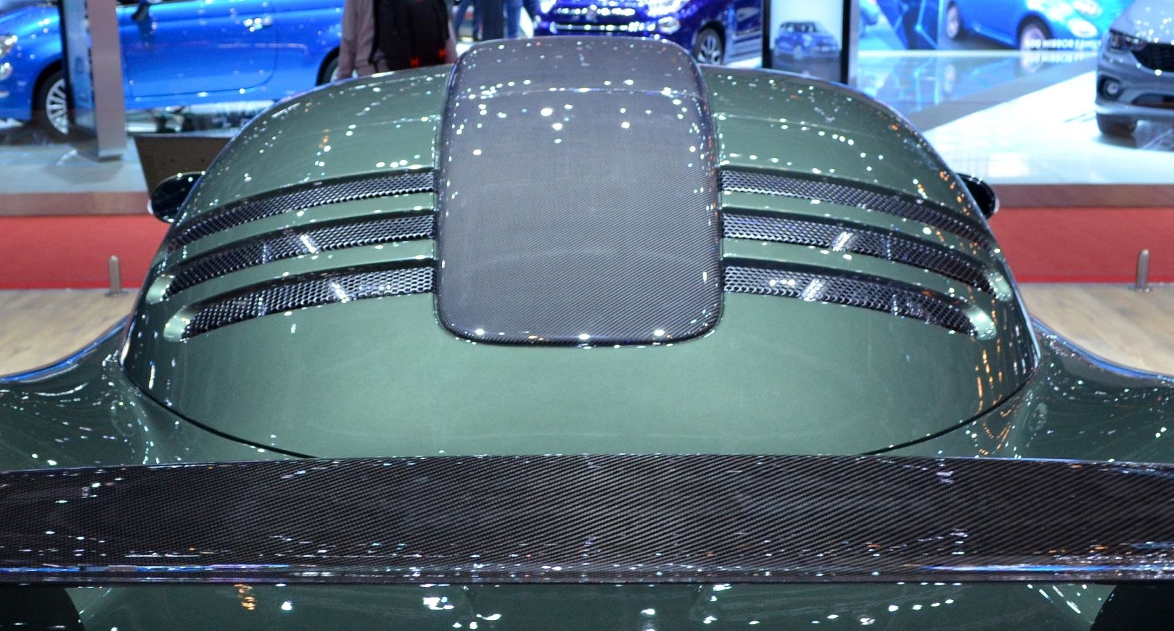 Rear engine deck with vents and carbon fiber spoiler