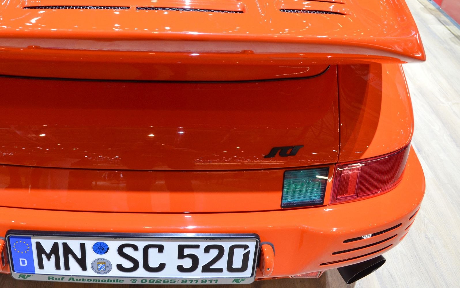 Bright orange rear spoiler and tail light section