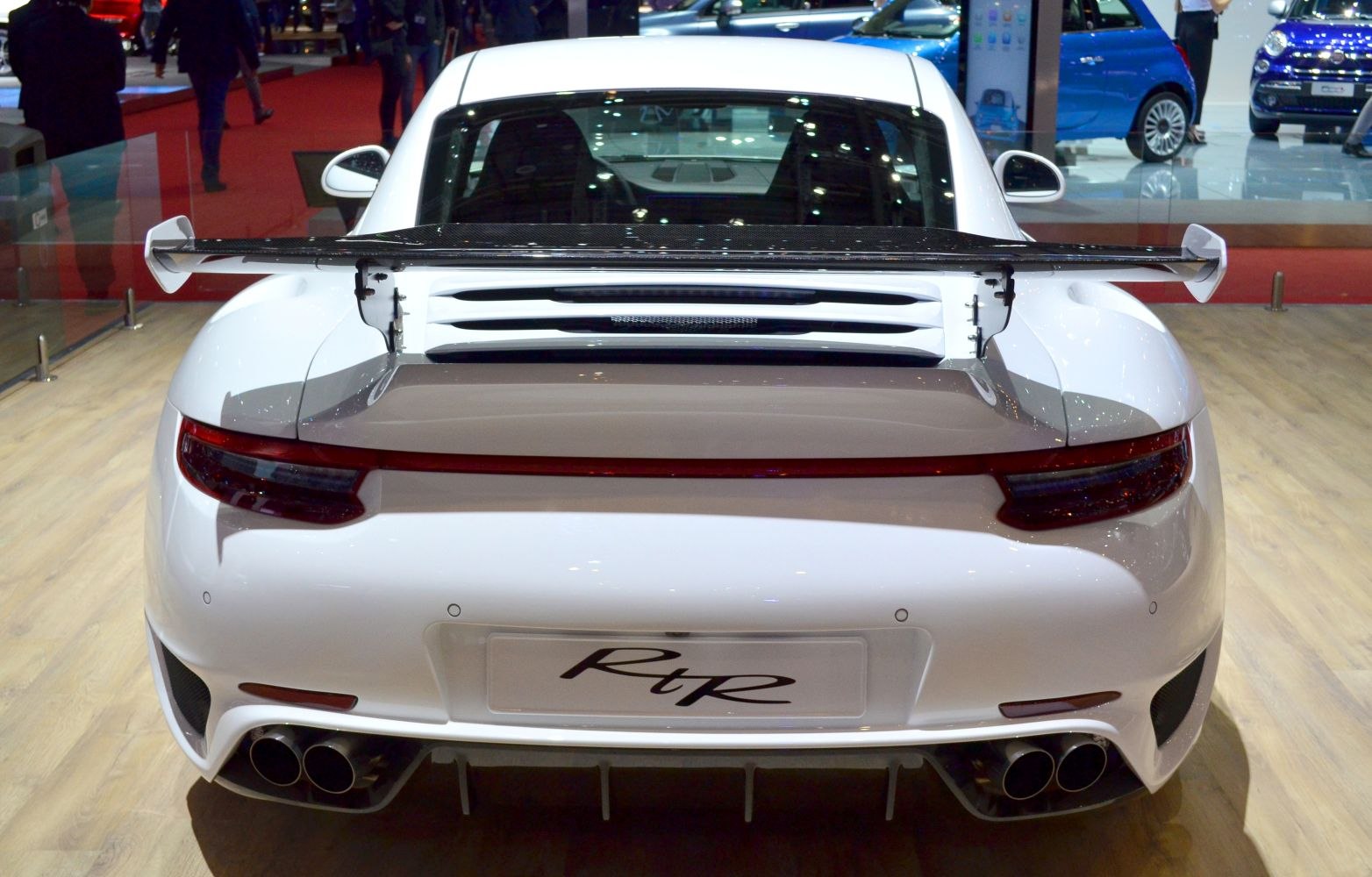 Rear view with large rear wing and quad exhaust tips