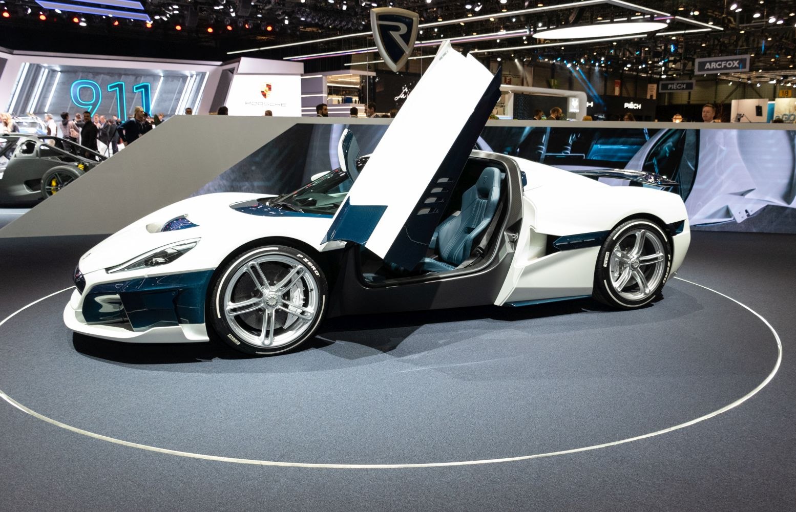 Sportscar with scissor-style doors and polished alloy wheels