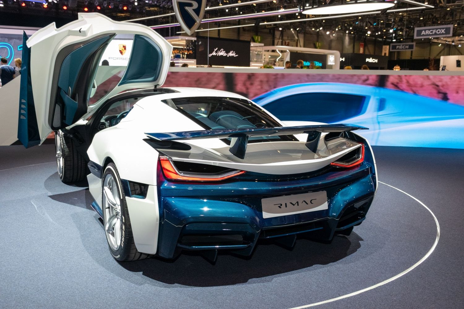 Rear view with open butterfly door and large wing spoiler