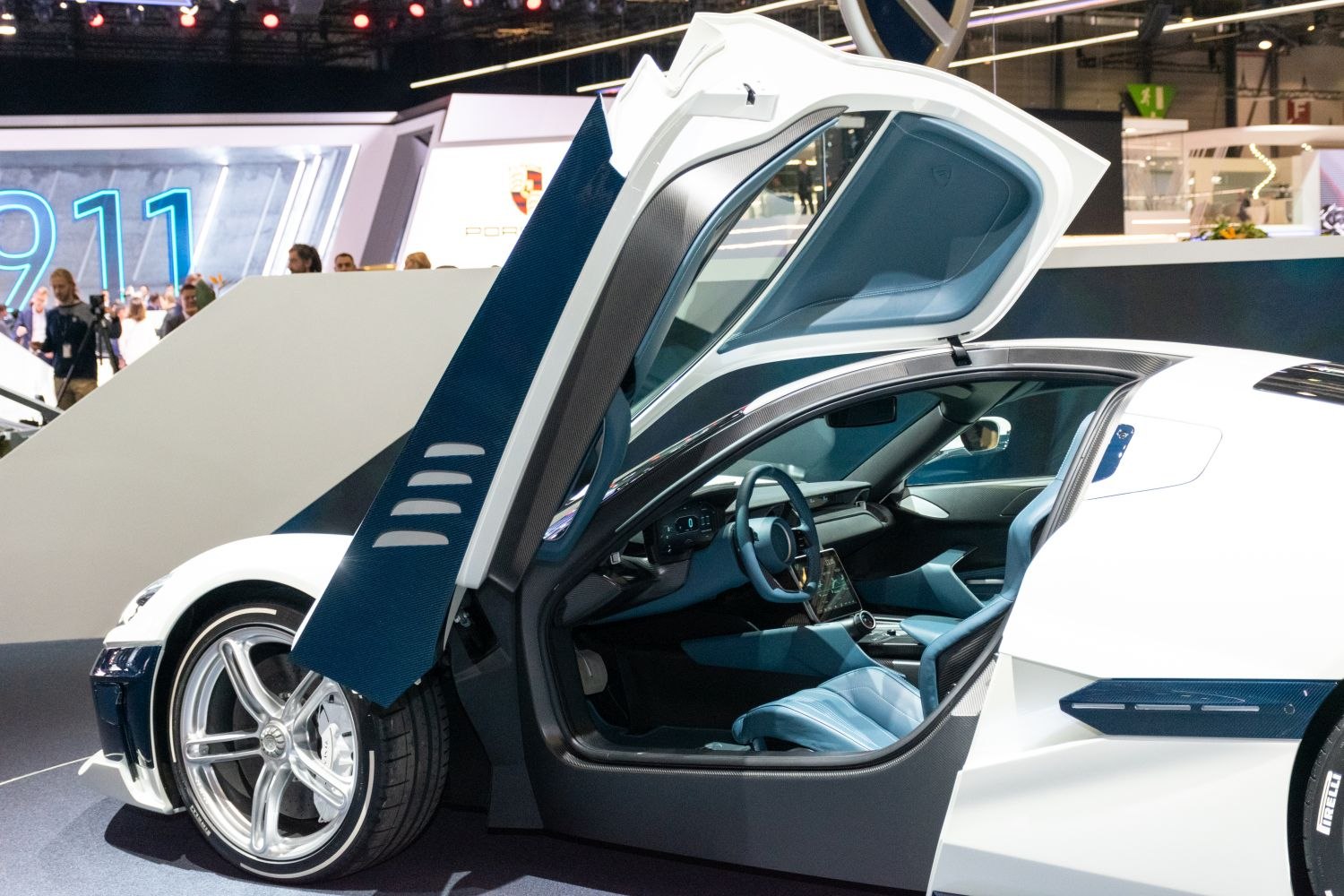 Gullwing door open showing blue interior and wheel