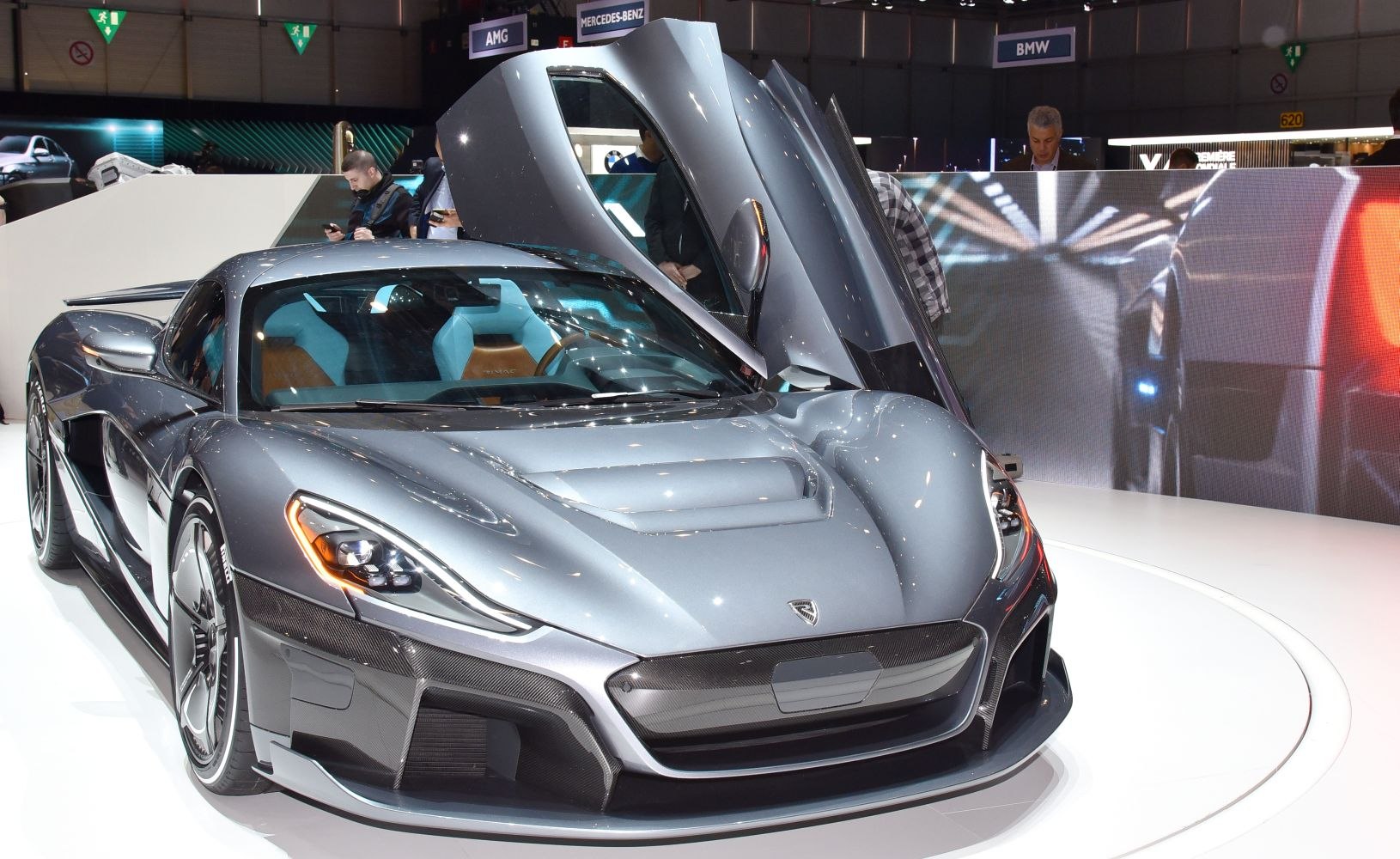 Electric hypercar with dihedral butterfly doors and sleek aerodynamic front