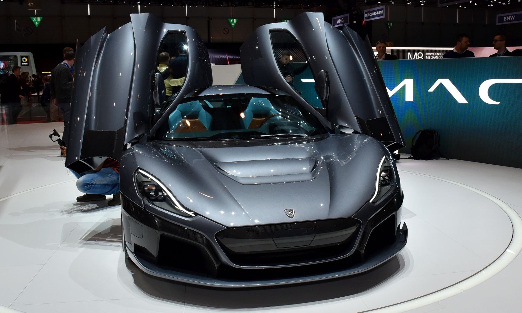 Butterfly doors and aerodynamic front design of a futuristic electric sports car.
