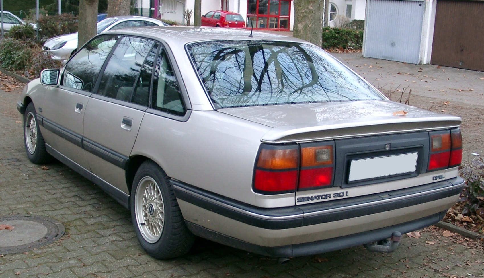 Rear view of a sedan with distinctive taillights and alloy wheels