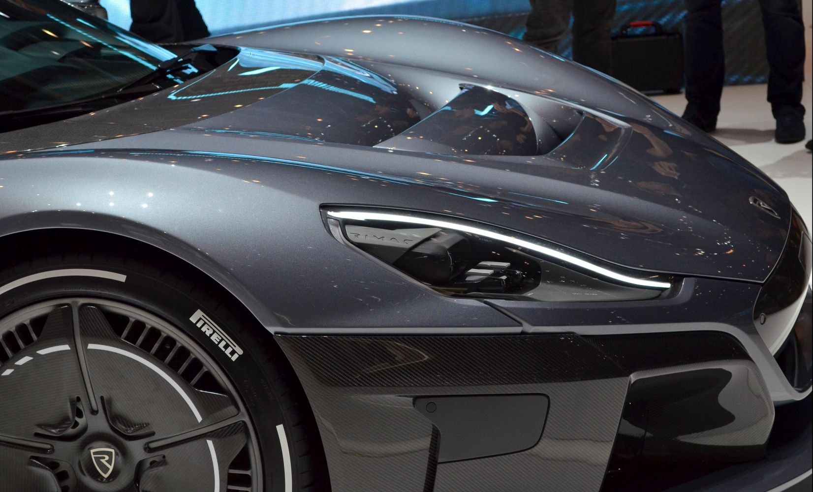 LED headlights and carbon fiber bodywork on a sports car front side