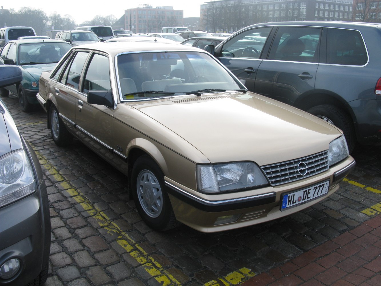 Front left view of classic 1982 sedan with angular headlights and chrome grille