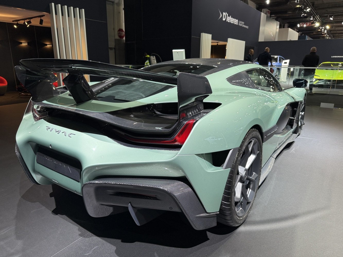 Aerodynamic rear with prominent carbon fiber wing and diffuser
