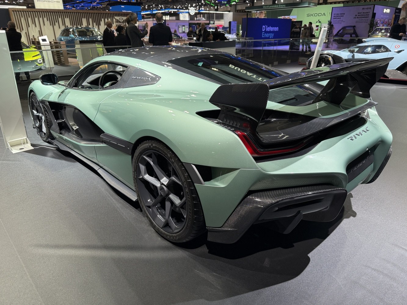 Rear angle with large carbon fiber spoiler and aerodynamic design.