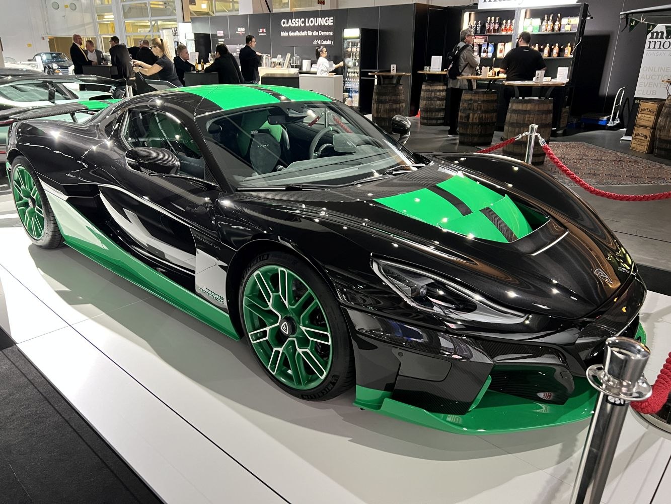 Aerodynamic black and green sports supercar with sleek, sharp styling and green accents