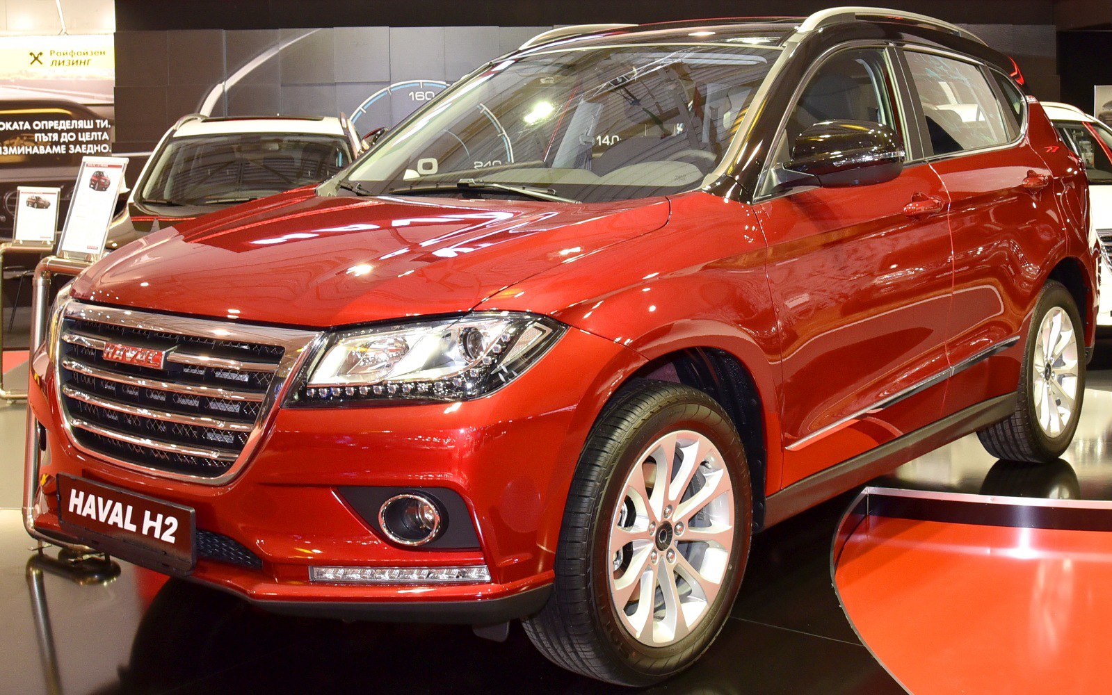 SUV front view with LED headlights, chrome grille, fog lamps, and alloy wheels
