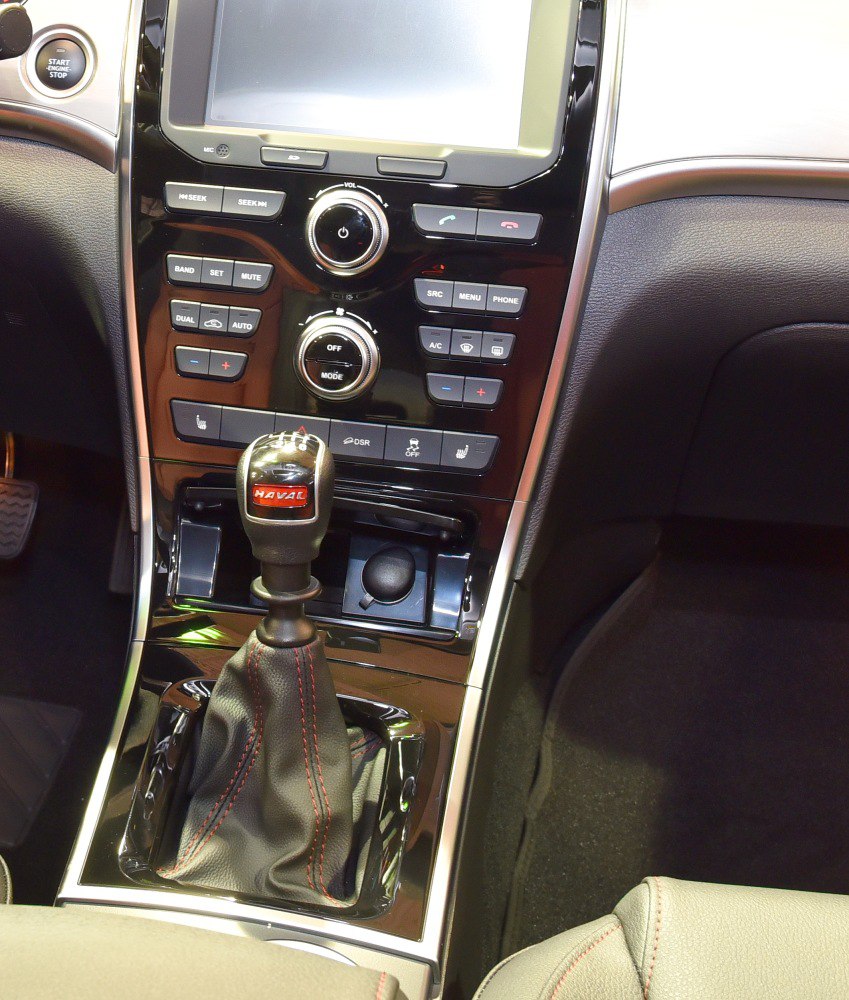 Gear shift and dual-zone climate control panel with multimedia buttons
