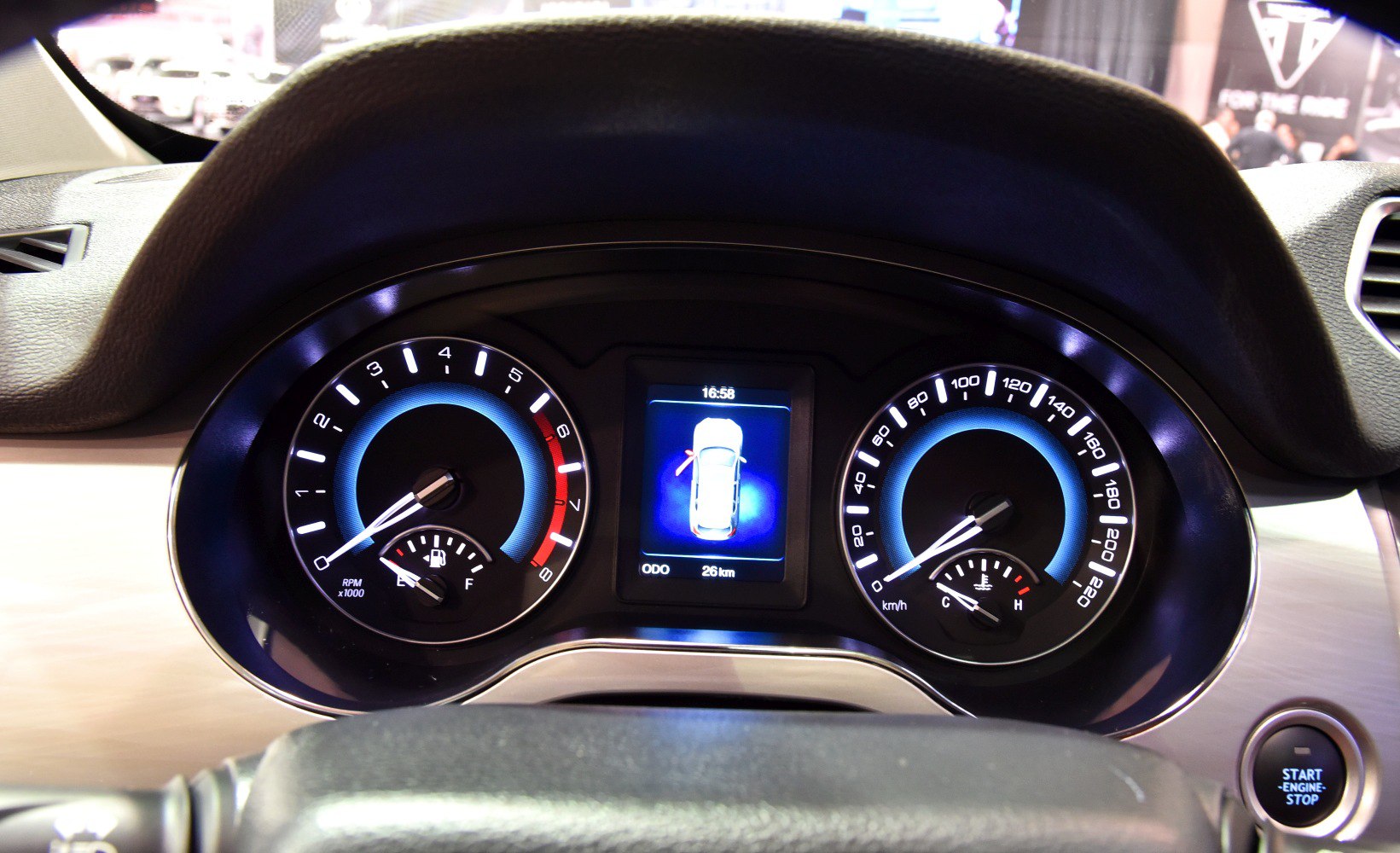 Instrument cluster with RPM, speedometer, fuel and temperature gauges, digital vehicle display.