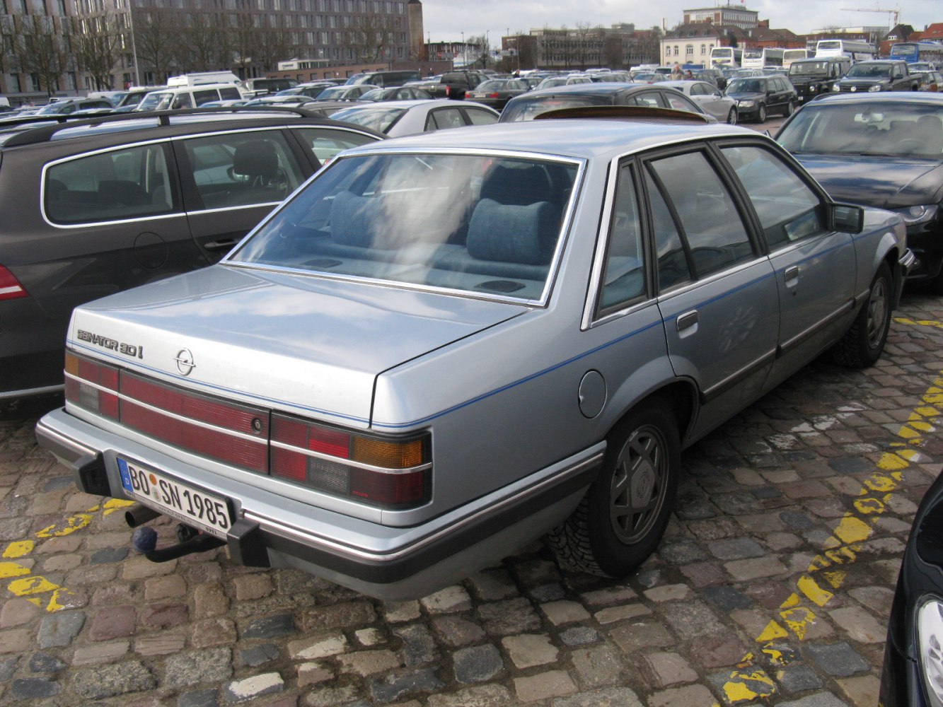 Classic sedan rear with large taillights and boxy 1980s design