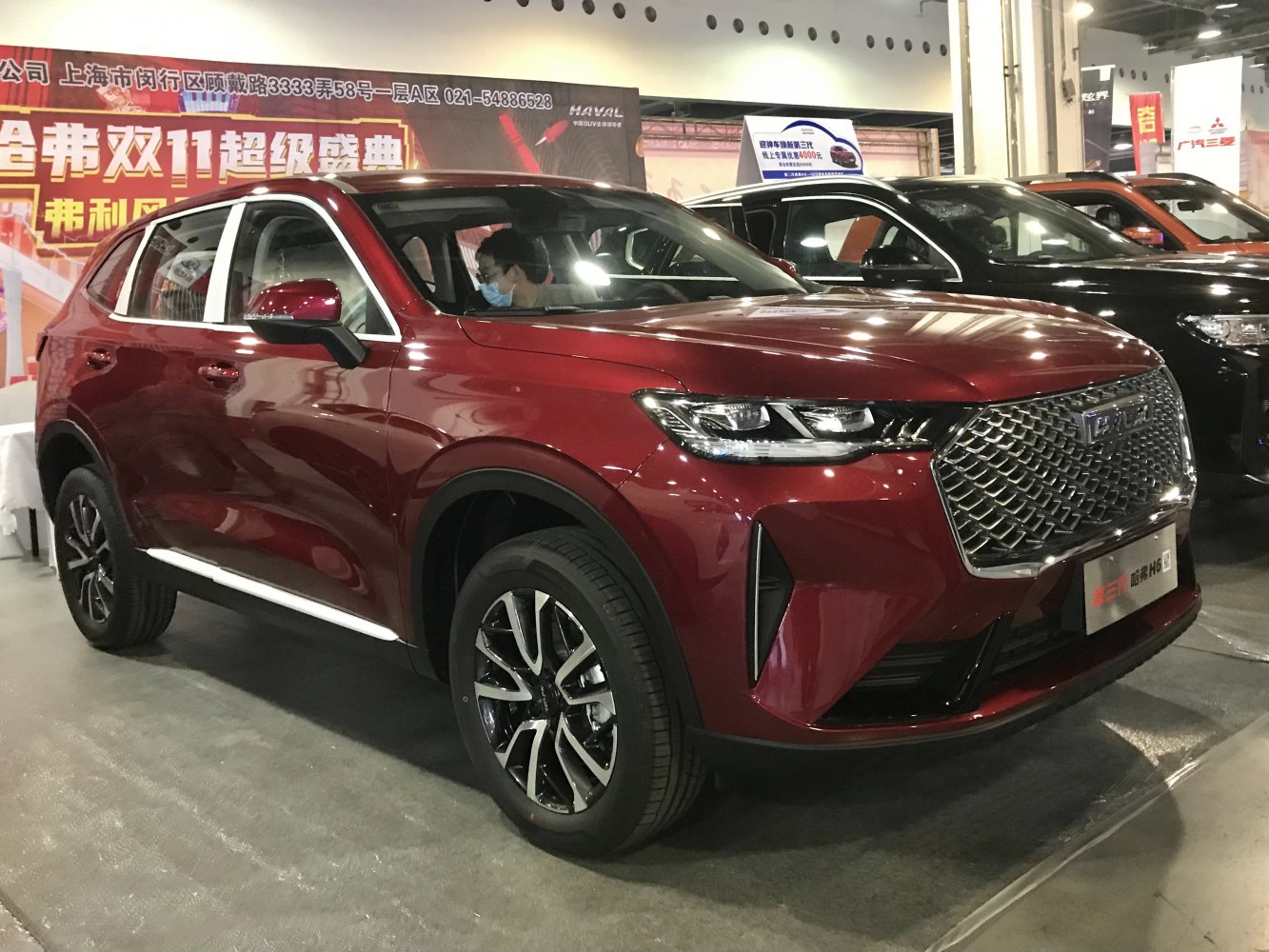 Modern SUV with large chrome mesh grille and LED headlights