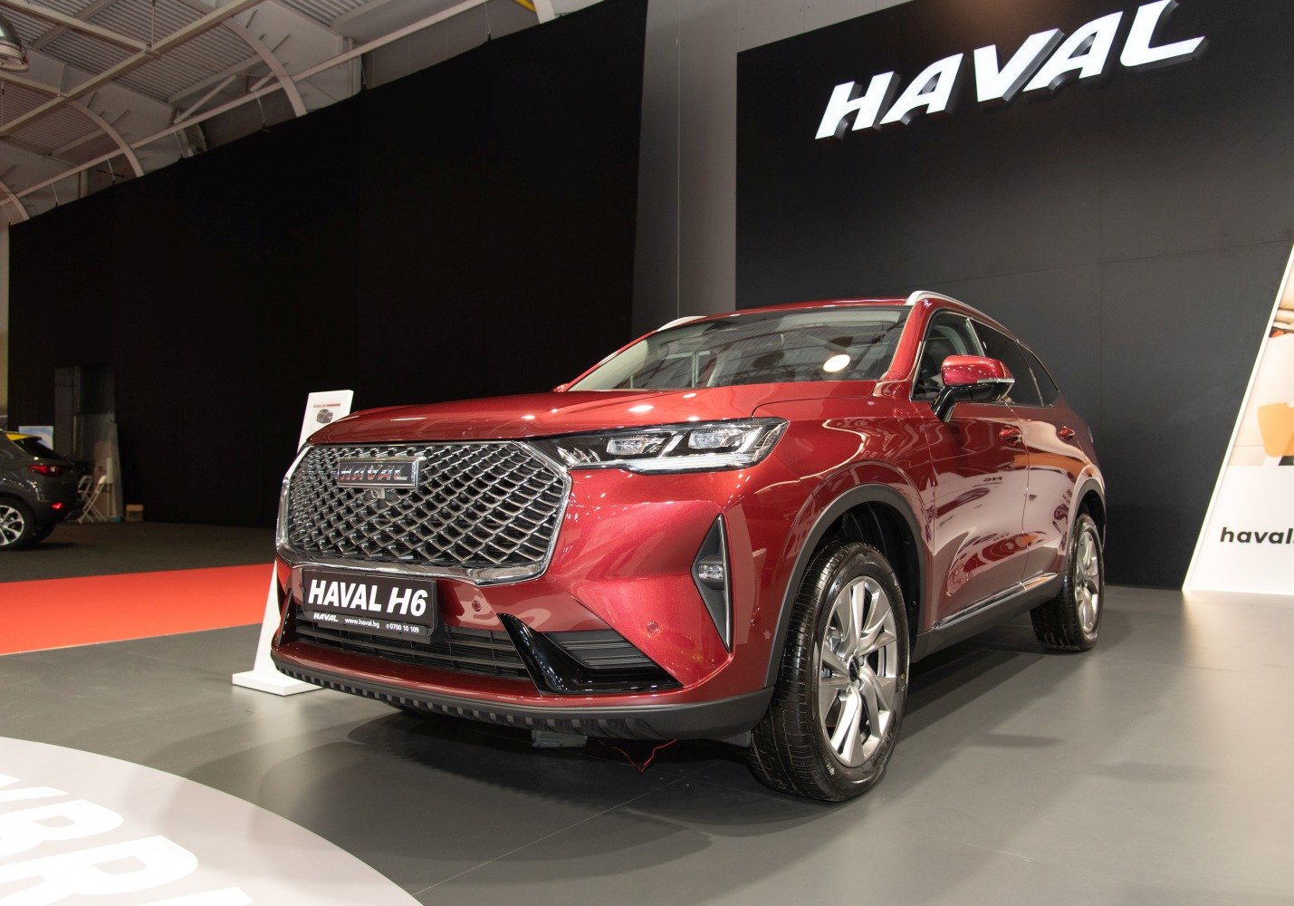 Front and side view with prominent grille and LED headlights