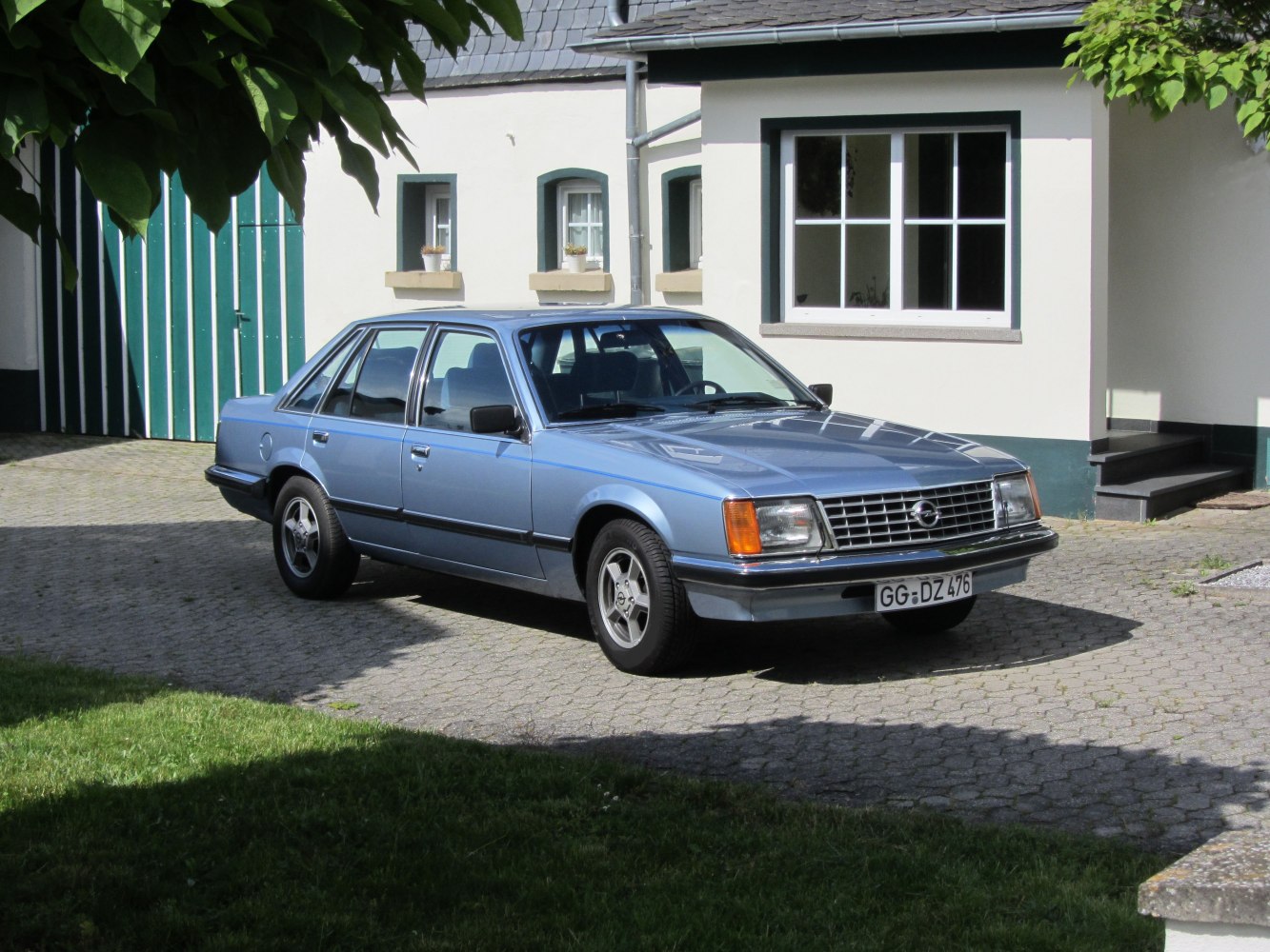 Classic sedan with rectangular headlights and chrome grille.