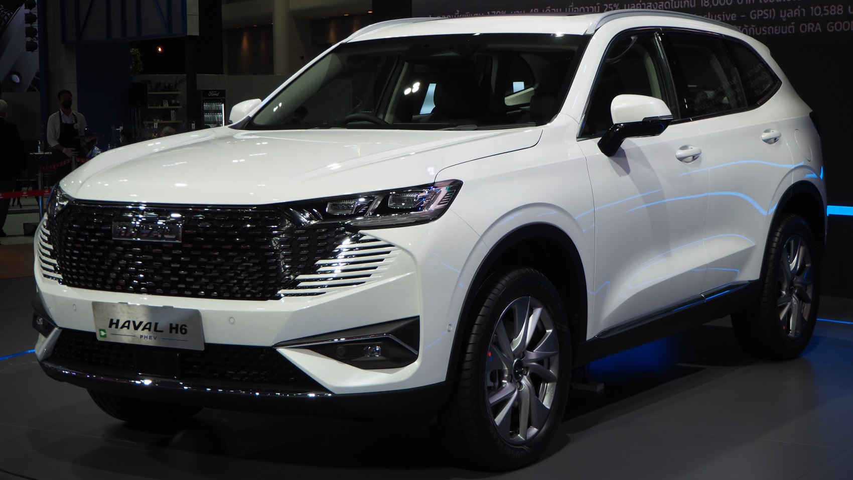 White SUV front and side view with LED headlights and large grille
