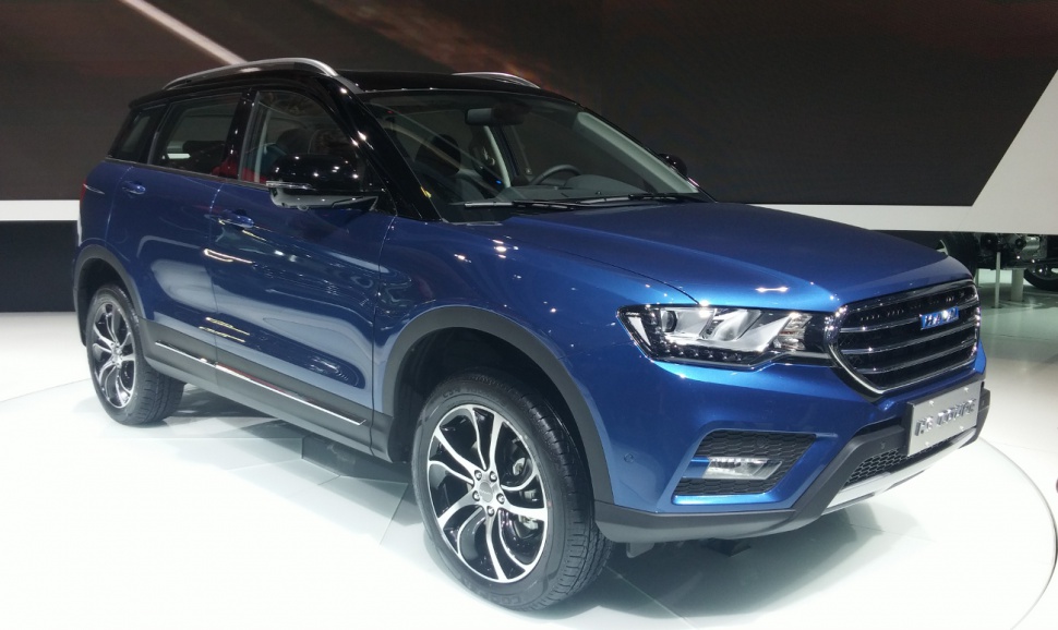 Blue SUV front-side view with LED headlights and alloy wheels