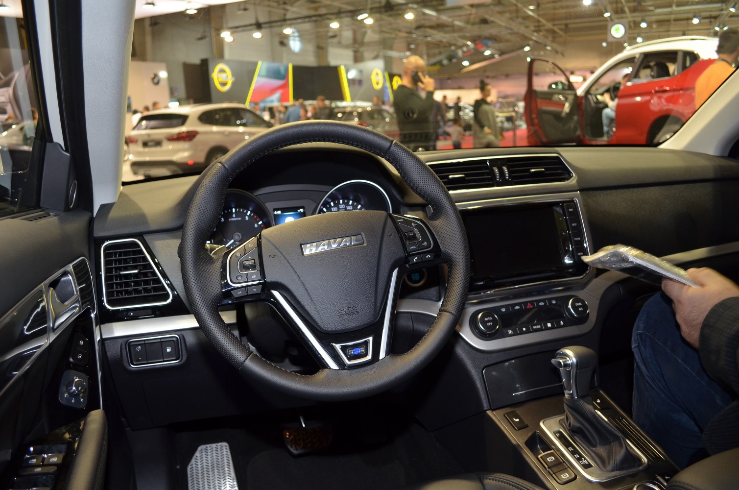 Interior with steering wheel, dashboard, and gear shift lever