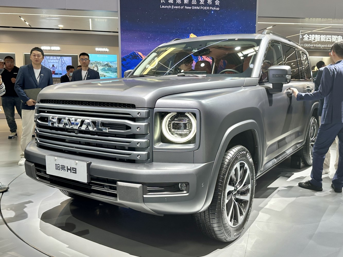 Close-up of front grille and circular LED headlights on a modern SUV