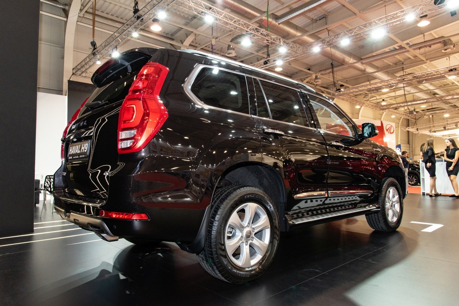 Rear side angle of black SUV with distinct tail lights and alloy wheels