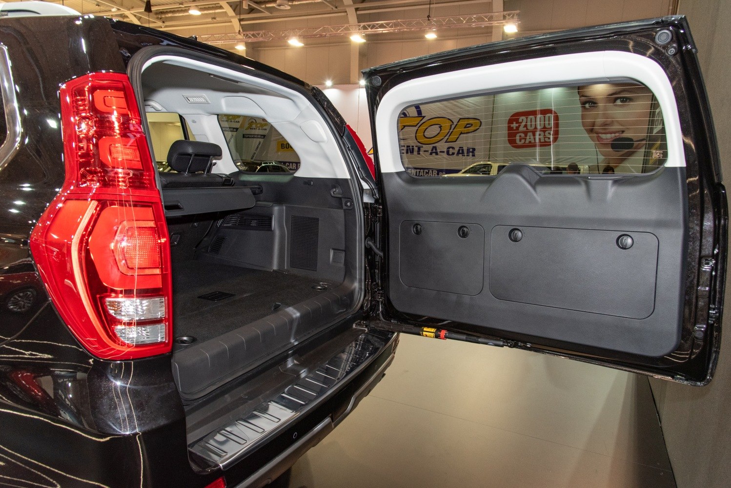Wide opening tailgate with spacious rear cargo area and interior panels
