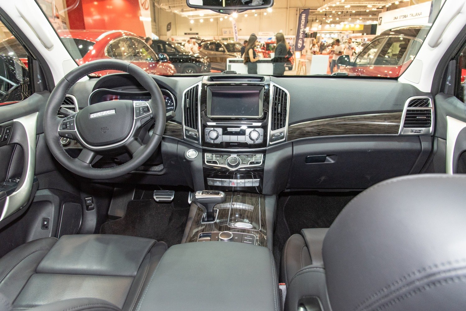 Leather seats, wood trim dashboard, advanced infotainment system, steering wheel controls