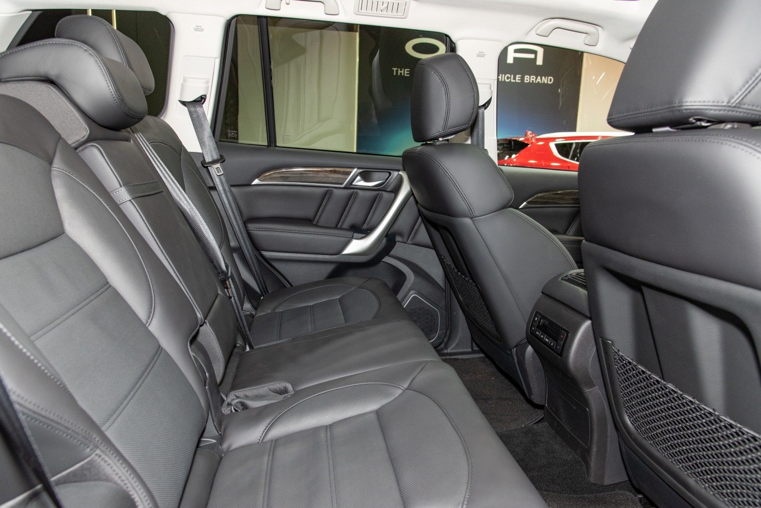 Black leather rear passenger seats with wood trim and rear climate control