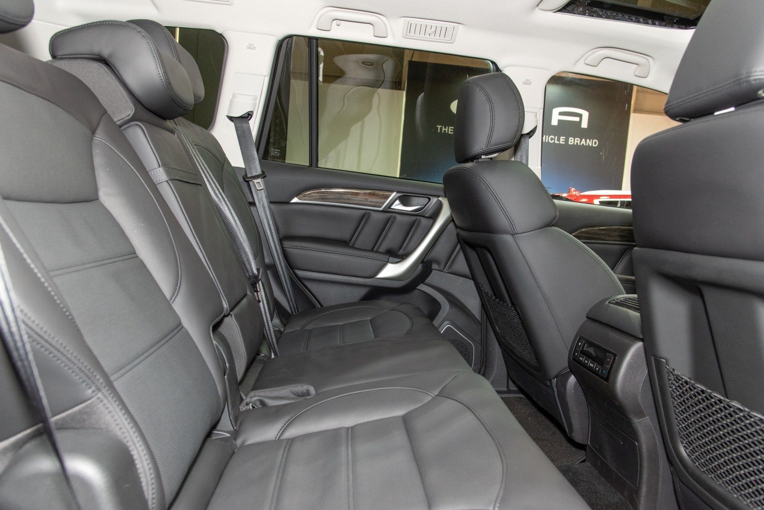 Spacious rear leather seats with headrests and door panel detailing