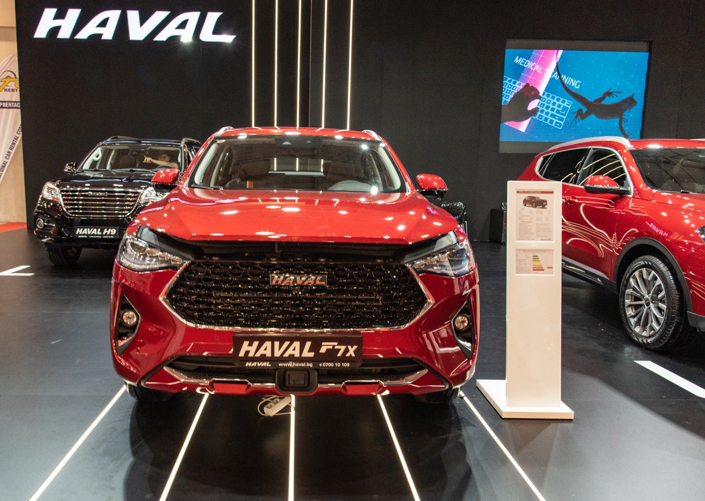 Modern SUV front grille with sleek headlights in red paint