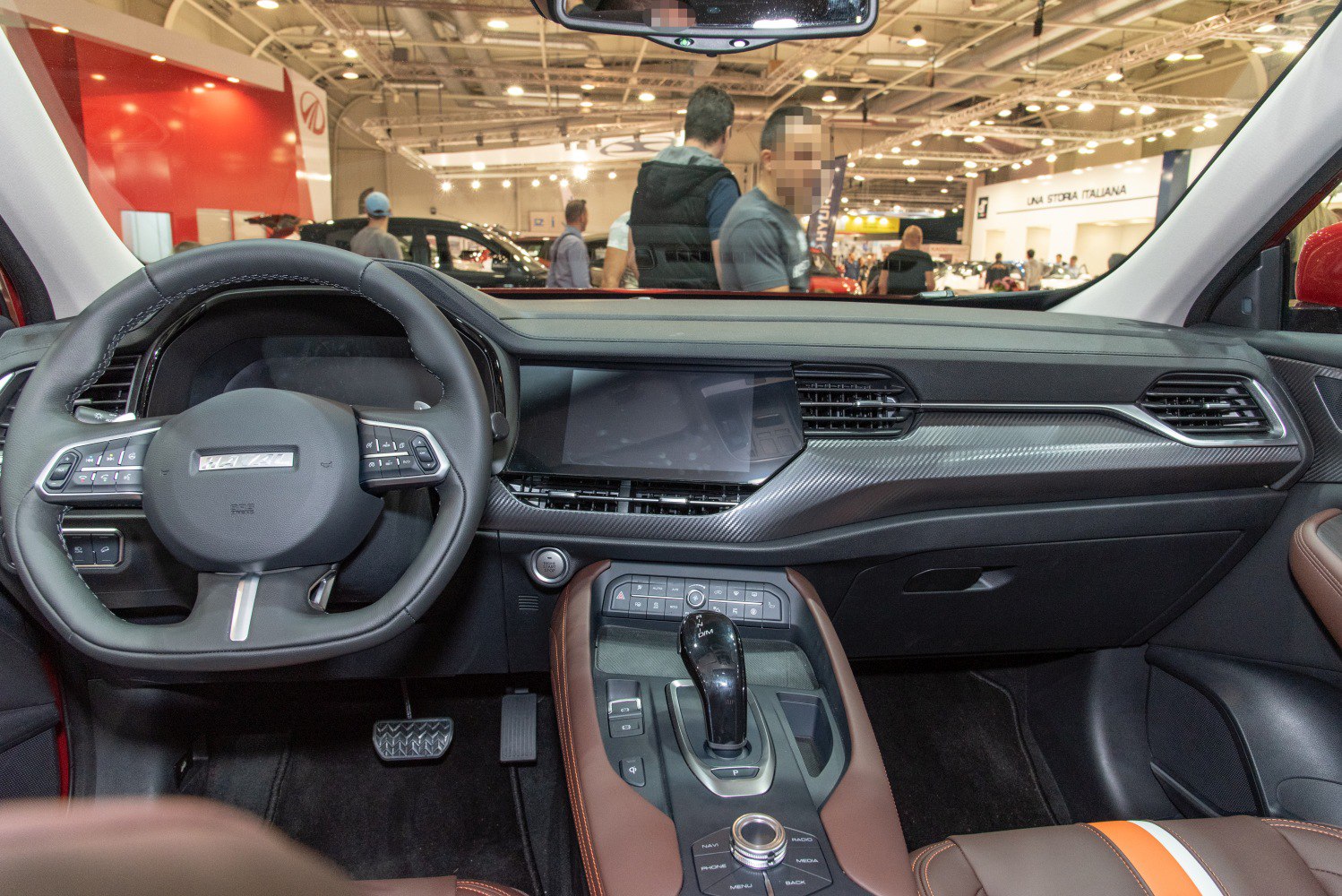 Dashboard and steering wheel with central console and carbon fiber trim