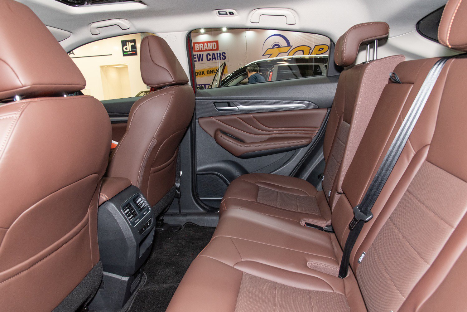 brown leather rear seats with rear air conditioning vents