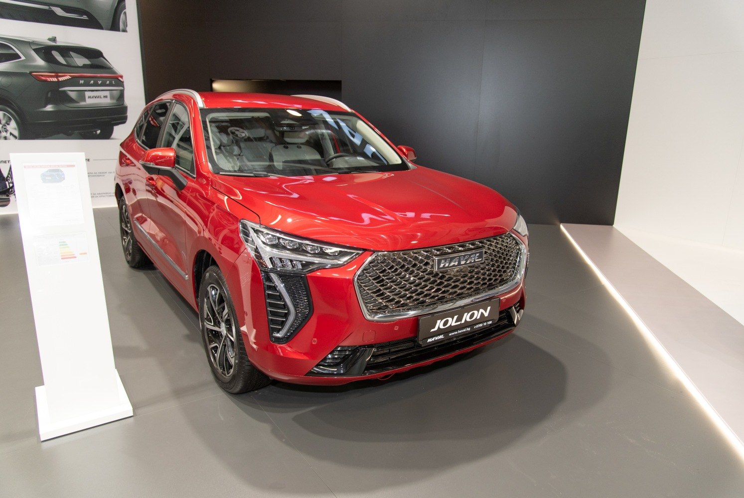 Red modern SUV with mesh grille and sharp LED headlights