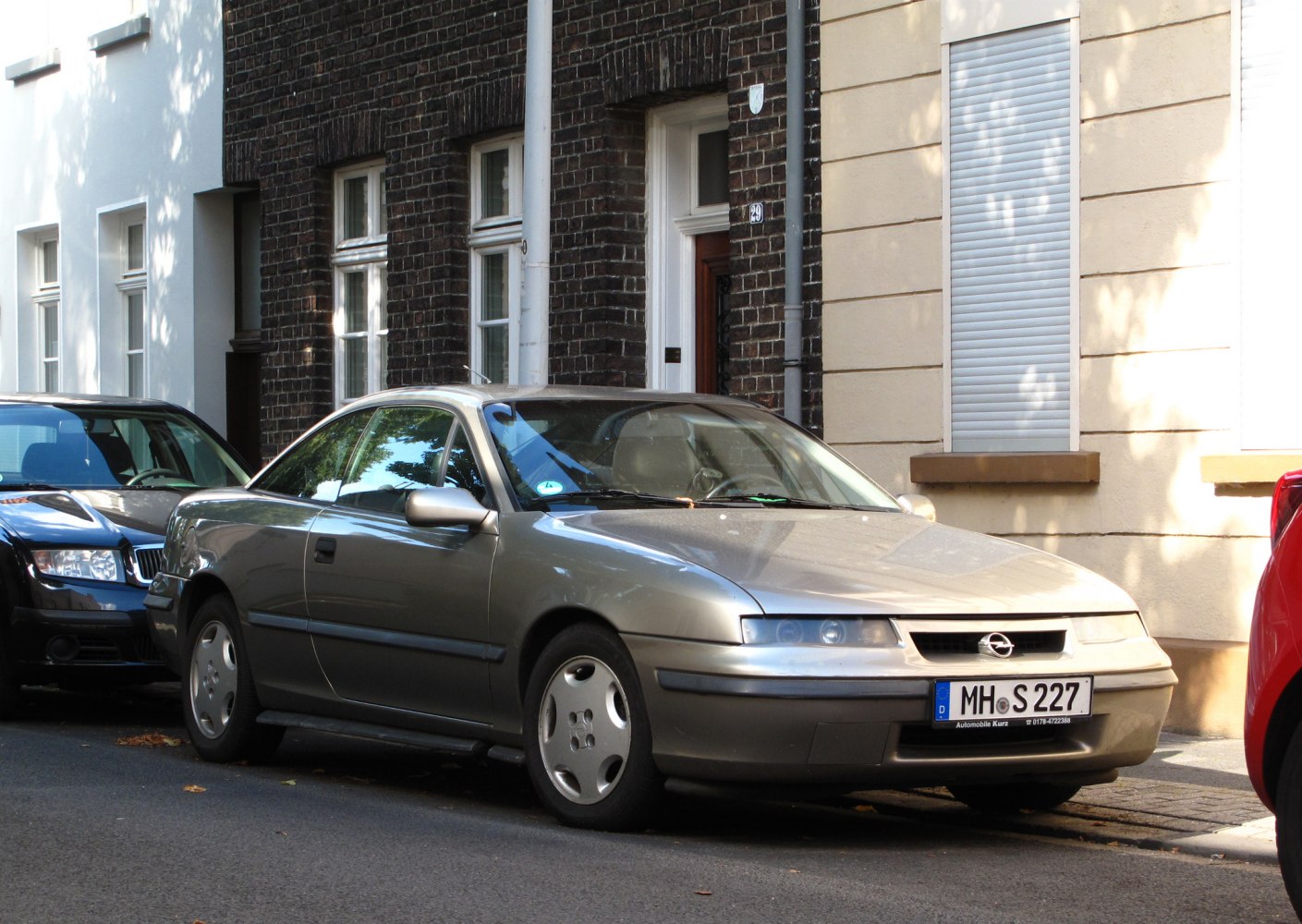 Side-front view with sleek headlights and aerodynamic body