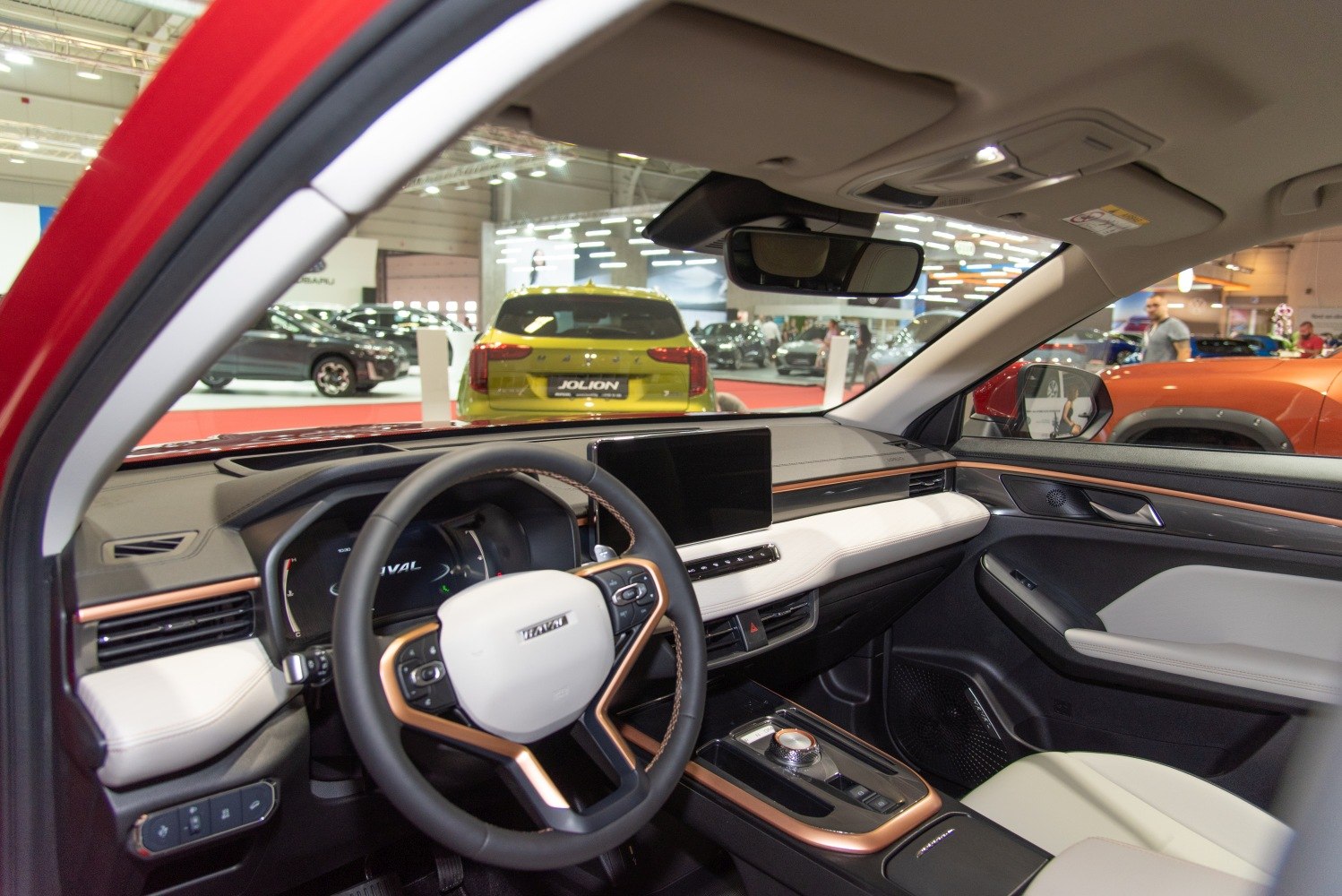 Modern car interior with dashboard, digital display, and multifunction steering wheel