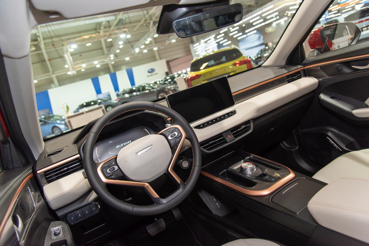 Modern car interior with digital dashboard and infotainment display.