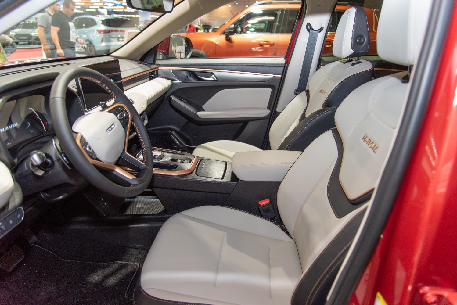 Modern dashboard with advanced controls and two-tone leather seating.