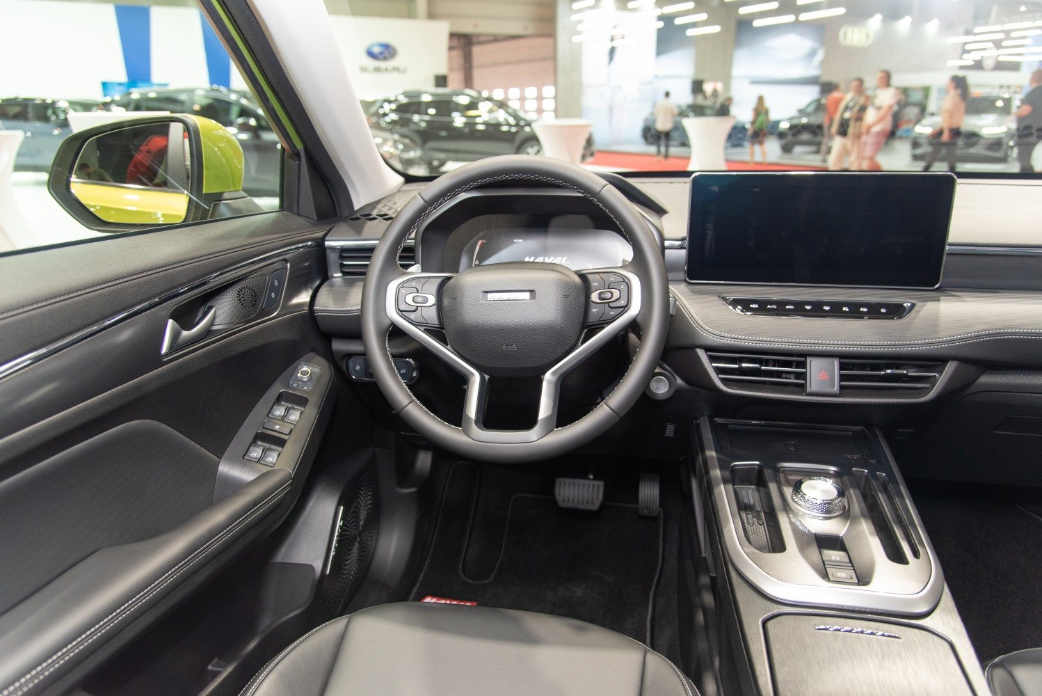 Modern digital dashboard and multifunctional steering wheel in premium SUV interior