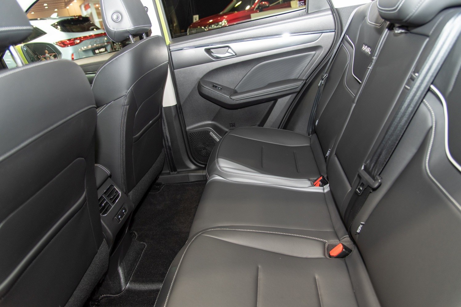 Spacious black leather rear seats with door panel and rear air vents