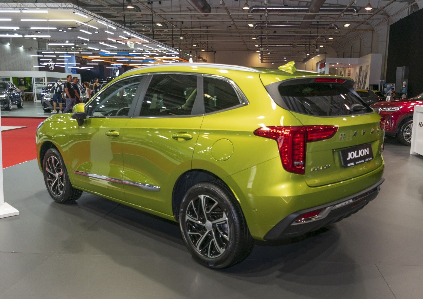 Bright green compact SUV rear with LED taillights and alloy wheels