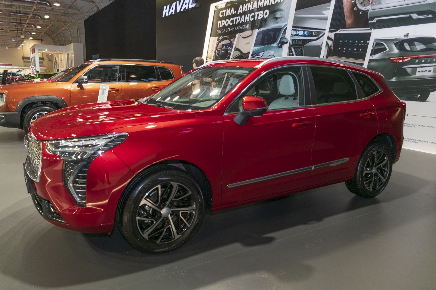 Red SUV side profile with LED headlights and alloy wheels
