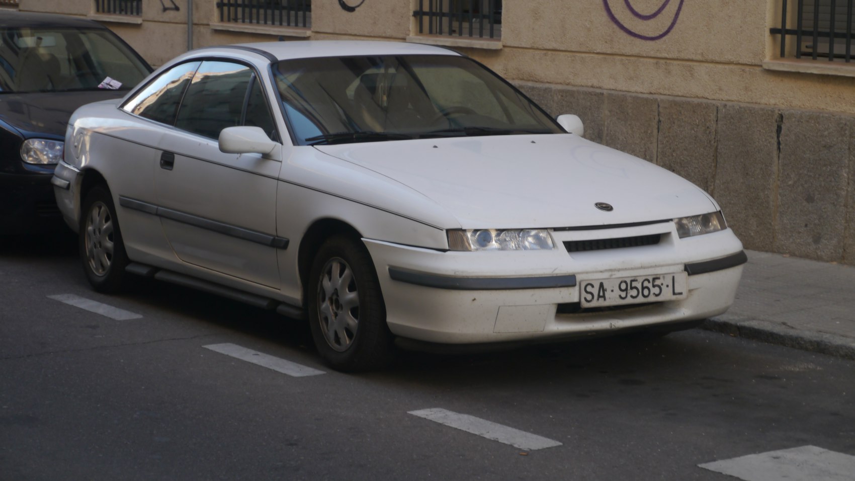 Front and side view of vintage sports coupe with aerodynamic shape