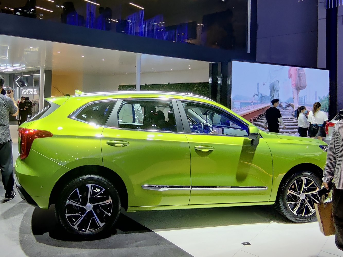 Bright green modern SUV side profile with alloy wheels
