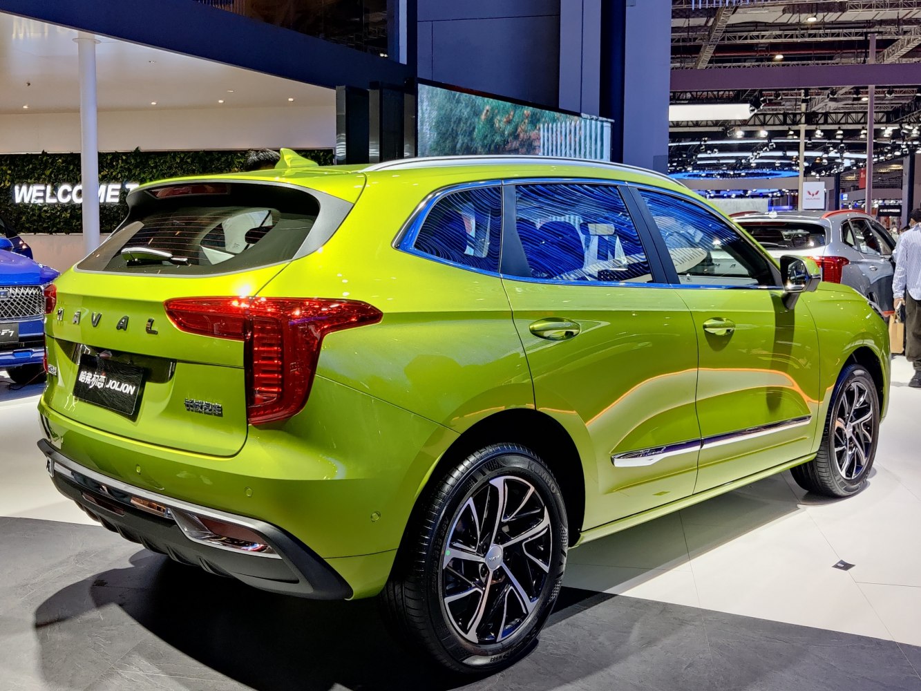 Bright green SUV rear and side with distinctive tail lights and alloy wheels